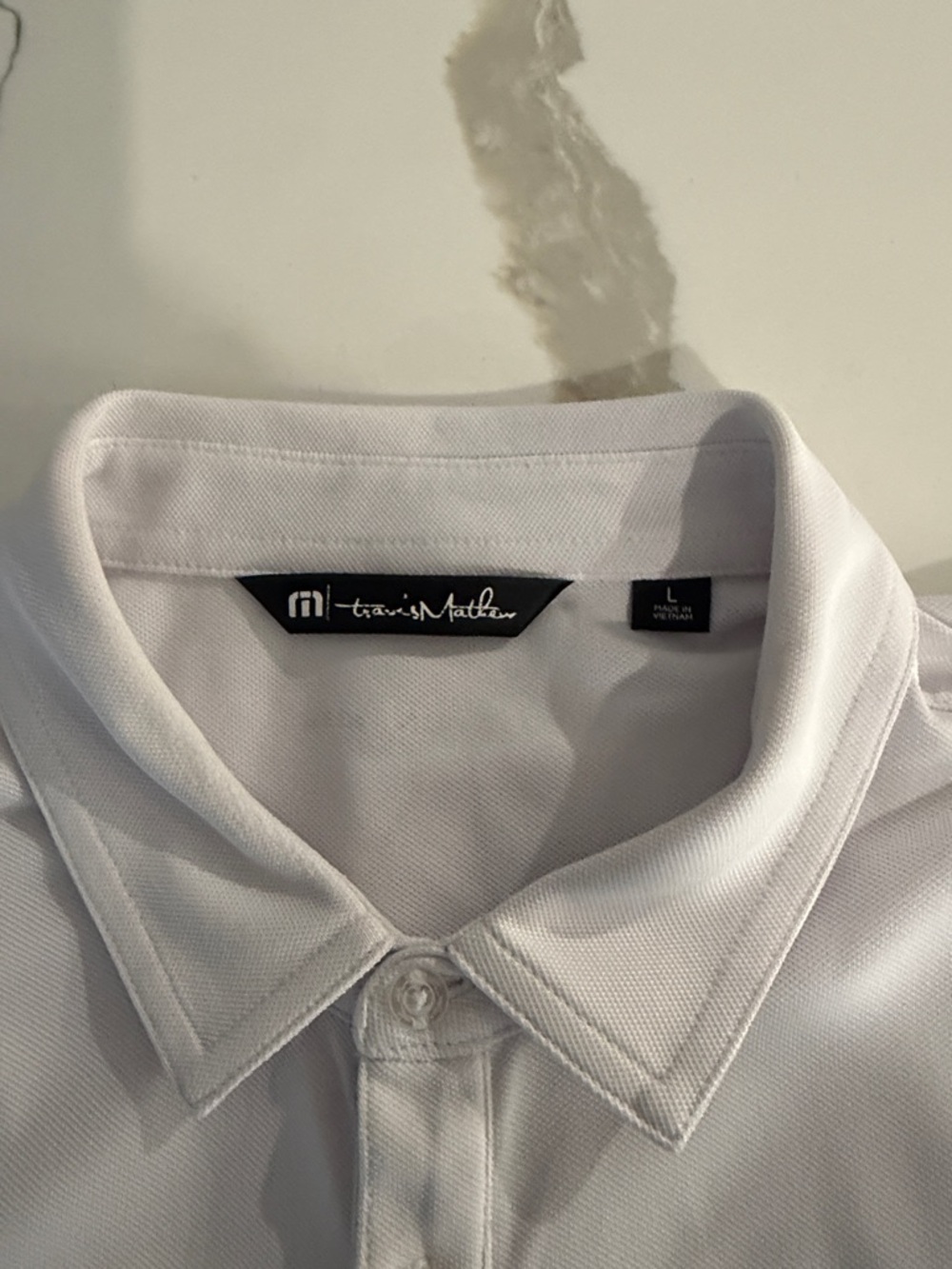 Travis Mathew White Polo with Navy and Yellow Stripes - Picture 2 of 5